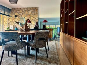 a dining room with a table and two chairs at Villa Helena in Le Cannet