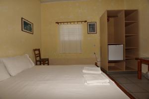 Postel nebo postele na pokoji v ubytování Anonymous Homestay