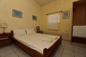 Postel nebo postele na pokoji v ubytování Anonymous Homestay