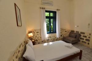 Postel nebo postele na pokoji v ubytování Anonymous Homestay
