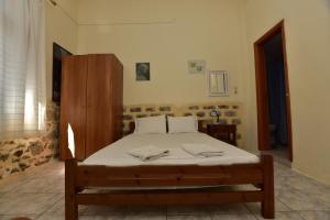 Postel nebo postele na pokoji v ubytování Anonymous Homestay