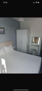 Postel nebo postele na pokoji v ubytování Pasifik Hotel + 37 fotografií