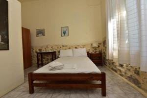 Postel nebo postele na pokoji v ubytování Anonymous Homestay