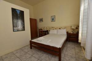 Postel nebo postele na pokoji v ubytování Anonymous Homestay