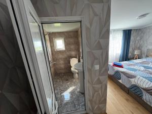 Postel nebo postele na pokoji v ubytování guesthouse gareji