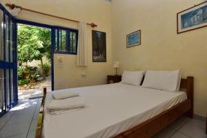 Postel nebo postele na pokoji v ubytování Anonymous Homestay
