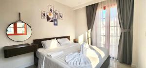 Postel nebo postele na pokoji v ubytování MEMENTO Apartment Phu Quoc