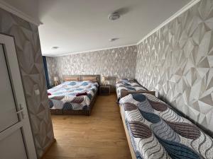 Postel nebo postele na pokoji v ubytování guesthouse gareji