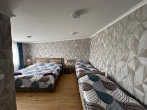 Postel nebo postele na pokoji v ubytování guesthouse gareji