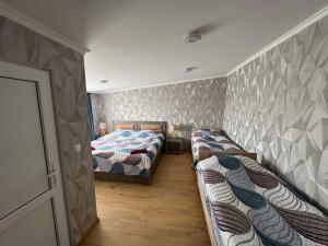 Postel nebo postele na pokoji v ubytování guesthouse gareji