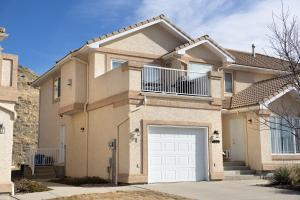 a large house with a white garage door at Paradise Canyon Golf Resort - Luxury Condo M403 in Lethbridge