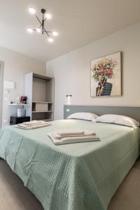 Postel nebo postele na pokoji v ubytování La Scala Suite