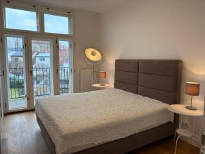 Katil atau katil-katil dalam bilik di Art Nouveau apartment with garden in Pisek