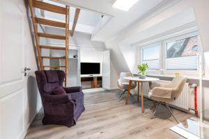 TV a/nebo společenská místnost v ubytování Haus Westsee Og Friesenstil modern