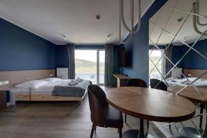 Ένα ή περισσότερα κρεβάτια σε δωμάτιο στο RentPlanet - Apartamenty IzerSKI Resort