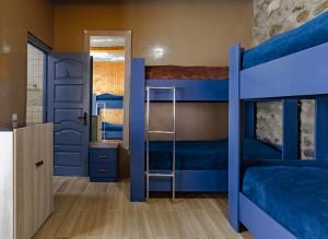 Letto o letti in una camera di Manoni Ratiani's Guesthouse