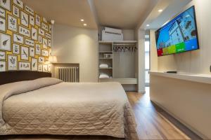 Postel nebo postele na pokoji v ubytování Hotel Titano