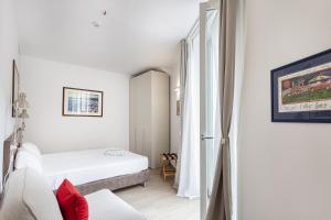 Brignole de Ferrari Refined Home by Wonderful Italy tesisinde bir odada yatak veya yataklar