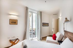 Brignole de Ferrari Refined Home by Wonderful Italy tesisinde bir odada yatak veya yataklar
