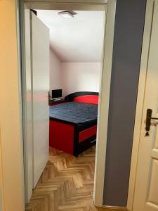 a small bedroom with a bed in a room at Tanasic in Zlatibor
