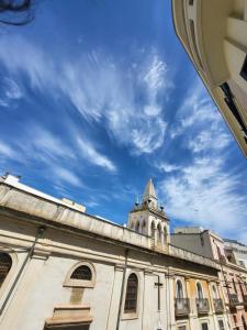 a building with a clock tower on top of it at Palazzo Annarita in Brindisi