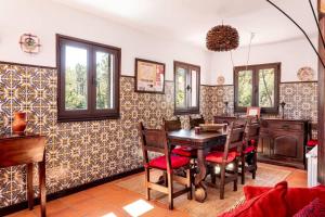 a dining room with a table and chairs at Gerês Mountain Lake Views by Gerês Casas in Geres
