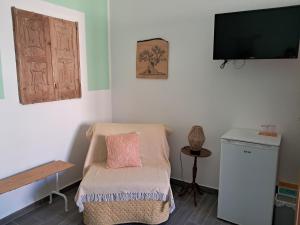 TV a/nebo společenská místnost v ubytování La casa di Aneupe
