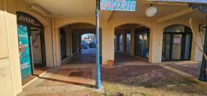a street sign on a pole in front of a building at Marina Apartment Port Grimaud in Grimaud
