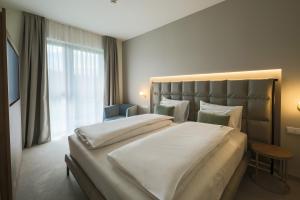 Postel nebo postele na pokoji v ubytování Hotel Essence