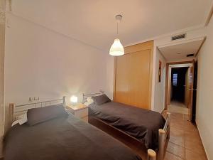 A bed or beds in a room at Lomas del Mar 5 Bajo