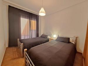 A bed or beds in a room at Lomas del Mar 5 Bajo