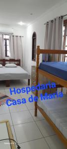 Postel nebo postele na pokoji v ubytování Hospedaria Casa de Maria