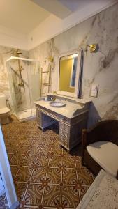 a bathroom with a sink and a mirror at Le N 9 in Argeliers +145 photos