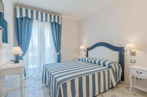 Postel nebo postele na pokoji v ubytování Hotel Ristorante Colleverde