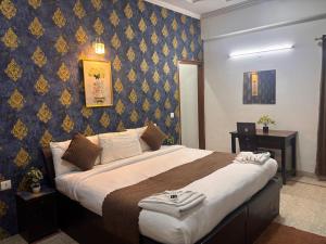 Postel nebo postele na pokoji v ubytování Hotel Stay 49 - Near Apollo Hospital