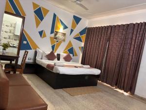 Postel nebo postele na pokoji v ubytování Hotel Stay 49 - Near Apollo Hospital