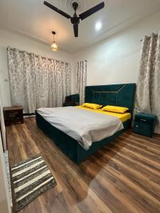 Letto o letti in una camera di John's Homestay