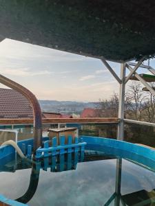 a swimming pool with a water slide at Cabana Ema in Curtea de Argeş