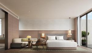 ein Schlafzimmer mit einem Bett, einer Couch und einem Tisch in der Unterkunft Holiday Inn Resort Ningbo Ninghai by IHG in Ninghai + 41 Fotos