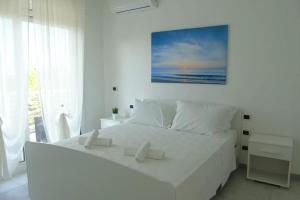 Ένα ή περισσότερα κρεβάτια σε δωμάτιο στο Homiday - Residence Prestige +184 φωτογραφίες