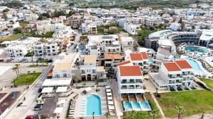 an aerial view of a city with white buildings at Chrispa's House Beachfront Bliss & Stunning Views 50m from the beach in Rethymno