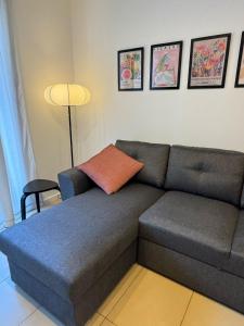 a couch with a pillow on it in a living room at Cala Paula in Lloret de Mar