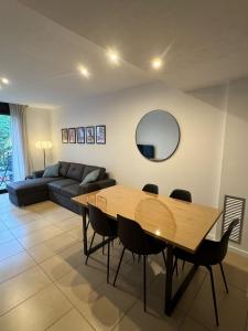 a living room with a table and a couch at Cala Paula in Lloret de Mar