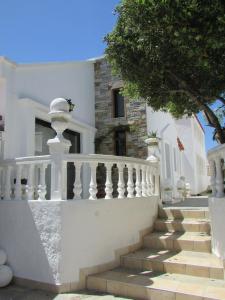 a white house with stairs in front of it at Castellino Studios in Faliraki