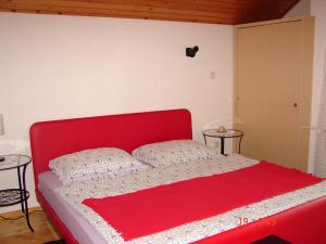 A bed or beds in a room at Apartma Žvan