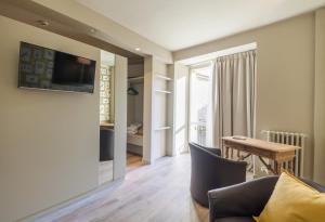 TV a/nebo společenská místnost v ubytování Hotel Titano