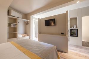 Postel nebo postele na pokoji v ubytování Hotel Titano + 37 fotografií