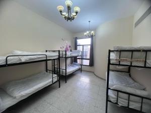 Postel nebo postele na pokoji v ubytování Al Ain Host