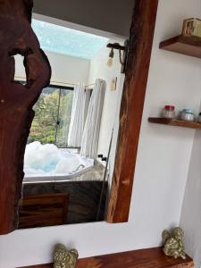 Postel nebo postele na pokoji v ubytování Elysium Araucária Tiny house