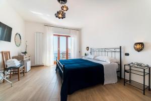 Łóżko lub łóżka w pokoju w obiekcie B&B Palazzo Pinto 2